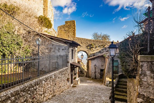 February 12, 2021 - Castel San Pietro Romano, Lazio, Rome, Palestrina - A glimpse of the medieval village, with the cobbled alley between the houses. The arch formed by the stone bridge of the castle.