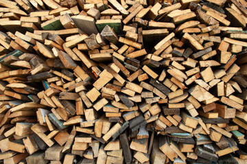 Wood Inside Sawmill. Wide banner or panorama wooden trunks. Sawmill.Natural sawn wood. The texture of the cut. Arranged boards in a sawmill. Harvesting firewood in the village. Pile of planks 