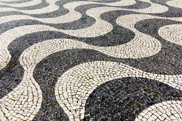 black and white waves stone paving on square in lisbon