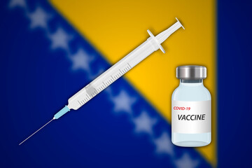 Syringe and vaccine vial on blur background with Bosnia flag,
