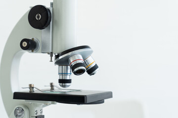 Microscope in classroom or laboratory. Science and education. Scientific experiment, Researcher, Research concept