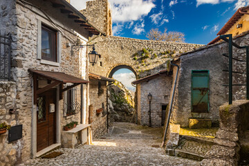 February 12, 2021 - Castel San Pietro Romano, Lazio, Rome, Palestrina - A glimpse of the medieval village, with the cobbled alley between the houses. The arch formed by the stone bridge of the castle.