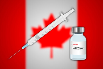 Syringe and vaccine vial on blur background with Canada flag