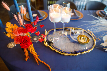 blue wedding cake stands on a blue table
