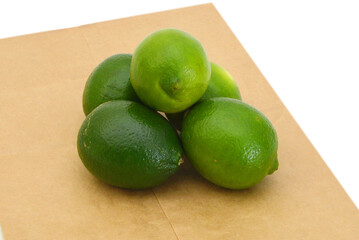 Fresh ripe lime isolated on brown paper