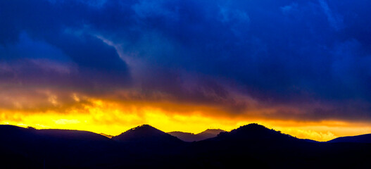 Fototapeta na wymiar Sunset with Silhouette horizon, mountains, sunrise 