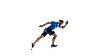 In air. Caucasian professional male athlete, runner training isolated on white studio background. Muscular, sportive man. Concept of action, motion, youth, healthy lifestyle. Copyspace for ad.