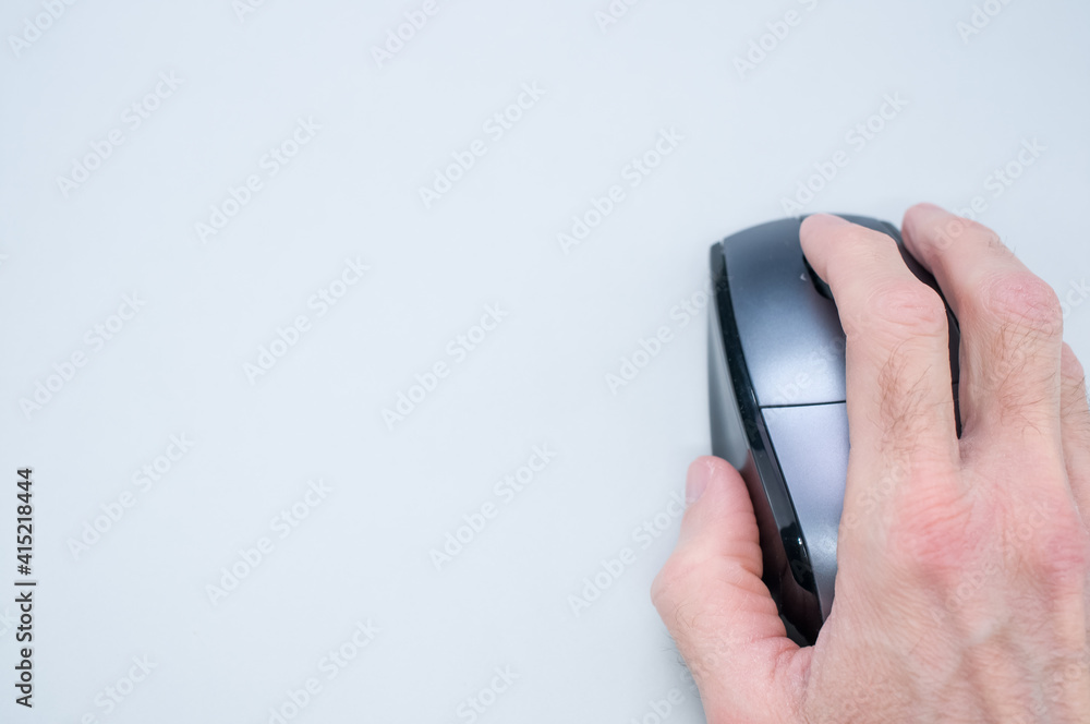 Poster closeup shot of a man hand using a computer mouse on a white background
