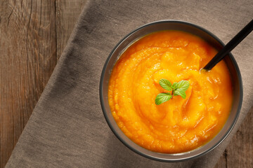 Pumpkin and carrot puree. Pumpkin soup top view, copy space.