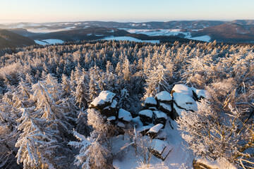 Rocks in the famous rocky city of Adrspach-Teplice rocks. Winter time trees, tourist routes and rocks covered with snow. known and popular place among tourists in the Czech Republic. Beauty christmas