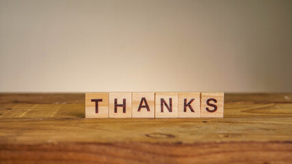 THANKS wording on wooden table
