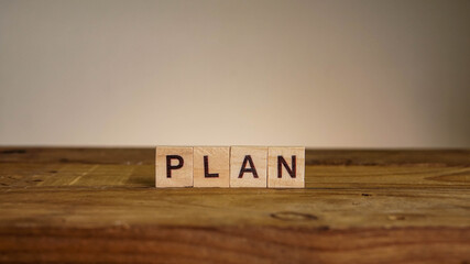 PLAN wording on wooden table