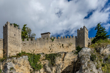 A glimpse of the ancient defensive walls of the Republic of San Marino on the summit of Monte Titano mountain