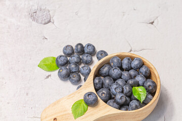 Fresh blueberries in a wooden mug. Natural vitamins concept