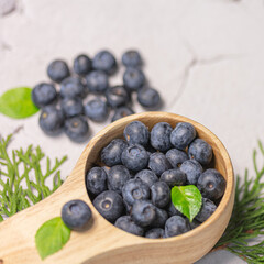 Fresh blueberries in a wooden mug. Natural vitamins concept