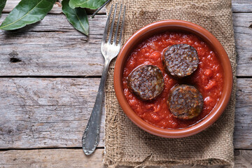 Rice blood sausage with tomato