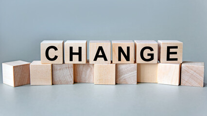 change, the inscription on wooden cubes on a white background