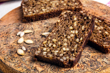 Sliced rye bread baked with sunflower seeds.