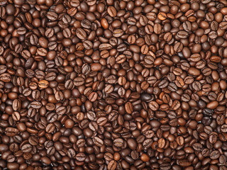 Coffee beans background, big fragrant roasted grains, food photo