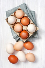 Farm fresh chicken  eggs  on rustic wooden background