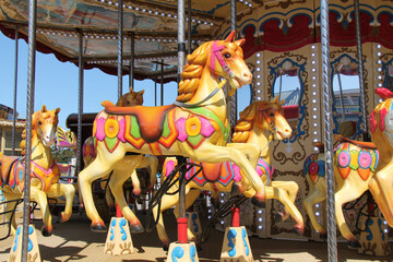 Fototapeta na wymiar The Wooden Horses on a Fun Fair Carousel Ride.