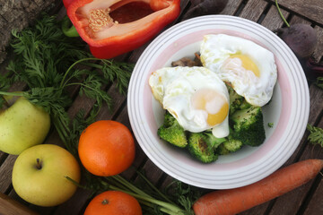 fried eggs with vegetables dish