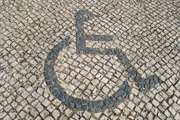 sidwalk,paving,signs,disable,person,wheelchair