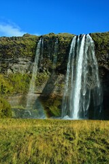 Iceland-view of the Seljalandsfoss waterfall and rainbow