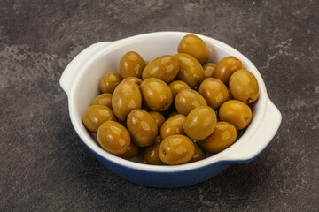 Green pickled olives in the bowl