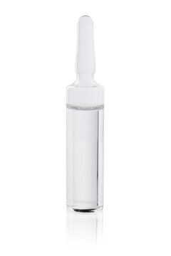 A clear glass ampoule filled with a medicine or vaccine. Isolated on a white background with reflection