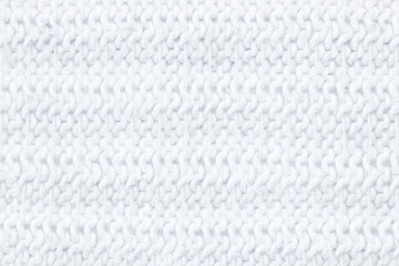 Close-up of clean, bright white textile with a horizontal pattern of woven threads.