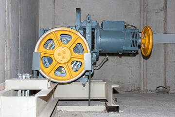 an electric elevator motor of a building elevator