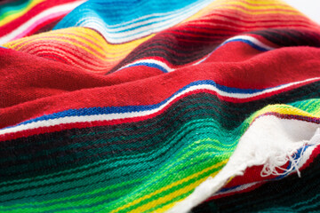 A view of a Mexican serape stripe blanket as a background.