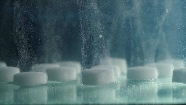 Extreme Close-up Of Dissolving A Salt Tablet In Water