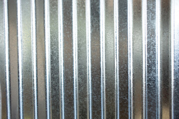 A view of a pleated sheet metal as a wall facade background.