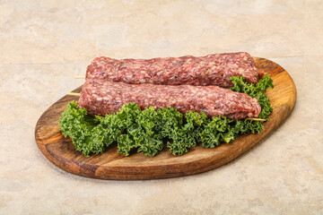 Raw minced beef kebab skewer