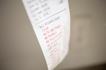 A closeup view of a restaurant order receipt.