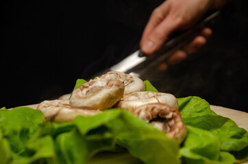 roasted mushrooms served on a green salad