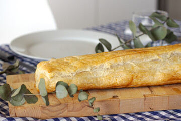 Delicious puff pastry on wooden board