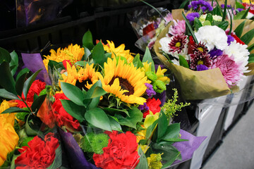 A view of several beautiful flower bouquets on display at a local florist shop.