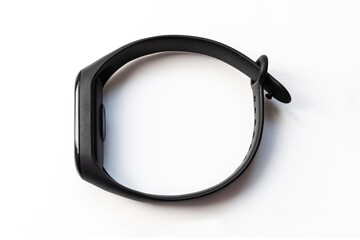 Black smart fitness bracelet, activity tracker on a white background. Sports electronic watch with...