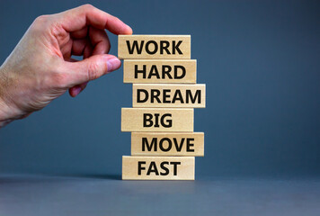 Work hard dream big symbol. Words Work hard dream big move fast on wooden blocks on a beautiful grey background. Businessman hand. Business, motivational and work hard dream big move fast concept.