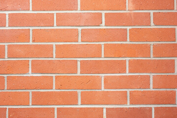 A view of a retro built brick wall facade as a background. 
