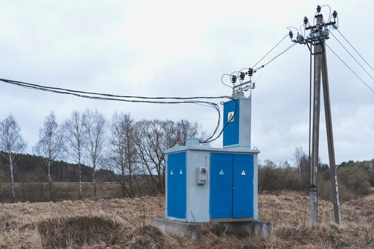 low-voltage transformer in the country, a new power line in the village, selective focusing, tinted image
