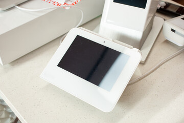 A view of a point-of-sale kiosk, seen at the counter of a local restaurant.