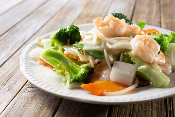 A view of a plate of shrimp chop suey.
