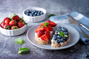 Fresh breakfast with Blueberry, Strawberry and raspberry ricotta rye sandwiches