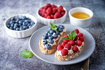 Fresh breakfast with Blueberry, Strawberry and raspberry ricotta rye sandwiches