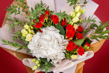 The girl with big bouquet of colorful flowers