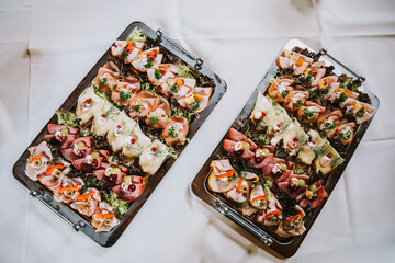 two cold meat slices plates on a dinner table